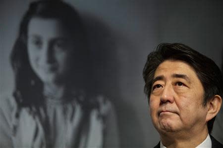 Japan's Prime Minister Shinzo Abe visits the Anne Frank House museum in Amsterdam March 23, 2014. REUTERS/Cris Toala Olivares