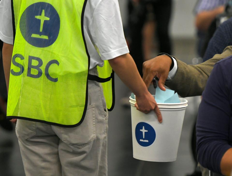 Delegates, known as messengers, cast their votes for president during the Southern Baptist Convention in Anaheim, California on June 14, 2022. (Photo by John McCoy)