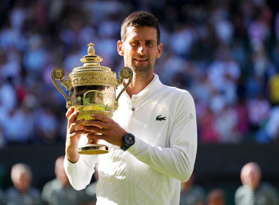 Novak Djokovic holds the Wimbledon trophy for the seventh time (Zac Goodwin/PA) (PA Wire)