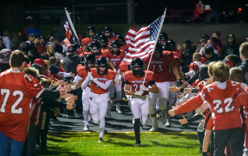 The Metamora Redbirds take the field against Canton on Friday, Sept. 23, 2022 in Metamora. The Redbirds defeated the Little Giants 54-20.