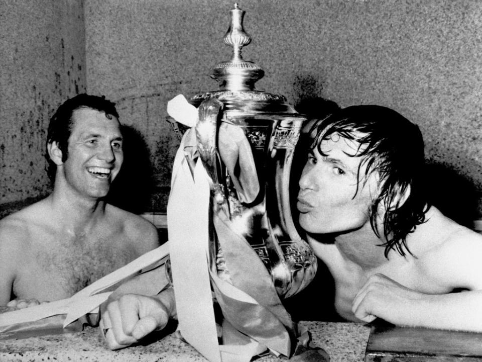 Stokes kissing the FA Cup as teammate Peter Osgood (L) looks on: Getty