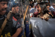 <p>Protesters push their way through a phalanx of riot police a day ahead of President Trump’s arrival on Nov. 11, 2017 in Manila, Philippines. (Photo: Jes Aznar/Getty Images) </p>