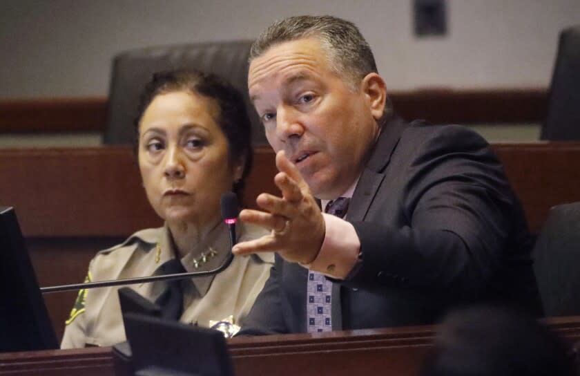 Sheriff Alex Villanueva, right, addresses the issue with Secret Deputy Sub-groups as new Asst. Sheriff Robin Limon looks on