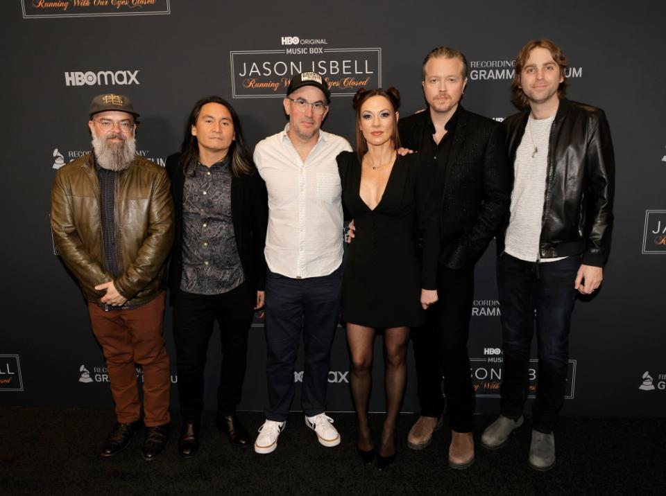 LOS ANGELES, CALIFORNIA - MARCH 23: (L-R) Jimbo Hart, Derry deBorja, Chad Gamble, Amanda Shires, Jason Isbell and Sadler Vaden arrive at the Los Angeles premiere of HBO's "Jason Isbell: Running With Our Eyes Closed" at The GRAMMY Museum on March 23, 2023 in Los Angeles, California. (Photo by Kevin Winter/Getty Images)