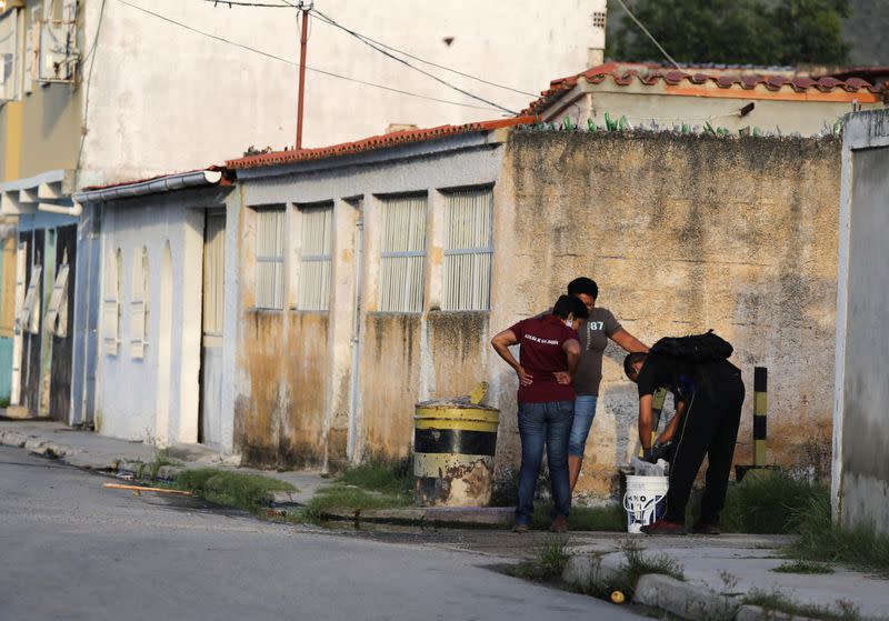 Juan Meza offers chickens for sale or trade to residents of San Joaquin