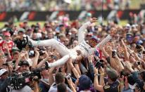 Britain Formula One - F1 - British Grand Prix 2016 - Silverstone, England - 10/7/16 Mercedes' Lewis Hamilton celebrates with fans after winning the race REUTERS/Matthew Childs Livepic EDITORIAL USE ONLY.