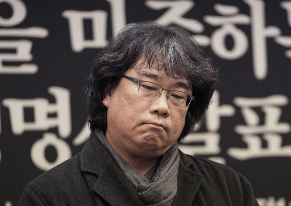 South Korean director Bong Joon-ho reacts during a press conference demanding an investigation into the case for the death of the late actor Lee Sun-kyun in Seoul, South Korea, Friday, Jan. 12, 2024. Lee, a popular South Korean actor best known for his role in the Oscar-winning movie "Parasite," was found dead in a car in Seoul on Dec. 27, 2023, authorities said, after weeks of an intense police investigation into his alleged drug use. (AP Photo/Ahn Young-joon)