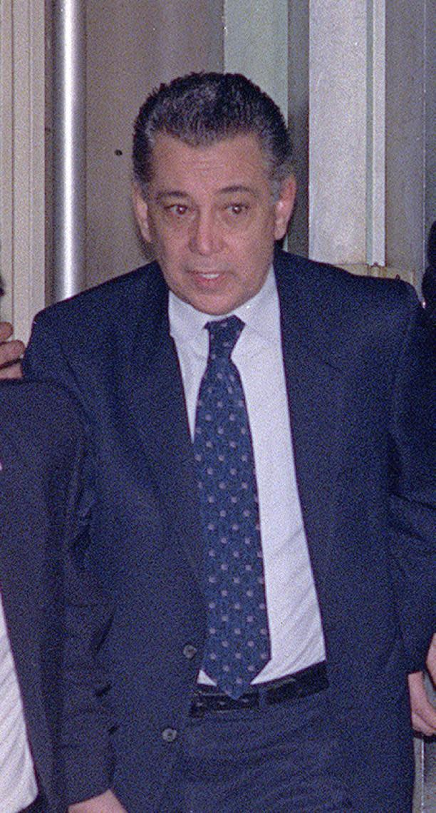 FILE – In this April 6, 1989, file photo, Nicodemo "Little Nicky" Scarfo walks through Common Pleas Court in Philadelphia. Scarfo, whose reign over the Philadelphia Mafia in the 1980s was one of the bloodiest in its history, died Saturday, Jan. 14, 2017, at the age of 87 while in custody at the Federal Medical Center in Butner, N.C. (AP Photo/Bill Cramer, File)