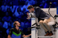 Russia's Daniil Medvedev speaks to the umpire during his singles semifinal tennis match of the ATP World Tour Finals against Italy's Jannik Sinner at the Pala Alpitour, in Turin, Italy, Saturday, Nov. 18, 2023. (AP Photo/Antonio Calanni)