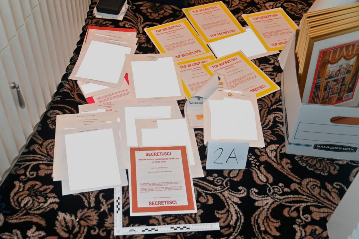 FILE - This image contained in a court filing by the Department of Justice on Aug. 30, 2022, and partially redacted by the source, shows a photo of documents seized during the Aug. 8, 2022, FBI search of former President Donald Trump's Mar-a-Lago estate. (AP)