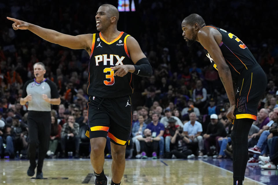 Phoenix Suns guard Chris Paul (3) makes a call during the second half of Game 2 of a first-round NBA basketball playoff series against the Los Angeles Clippers, Tuesday, April 18, 2023, in Phoenix. The Suns defeated the Clippers 123-109. (AP Photo/Matt York)