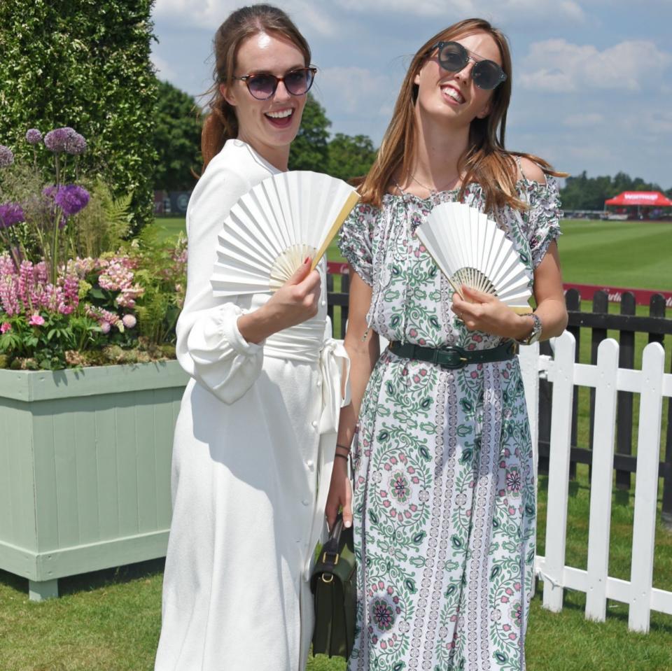 Lady Violet Manners (L) and Lady Alice Manners attend the Cartier Queen's Cup Polo final at Guards Polo Club on June 18, 2017 - Credit: David M Benett 