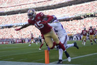 San Francisco 49ers wide receiver Jauan Jennings (15) is pushed by Minnesota Vikings cornerback Mackensie Alexander (24) after scoring during the first half of an NFL football game in Santa Clara, Calif., Sunday, Nov. 28, 2021. (AP Photo/Tony Avelar)