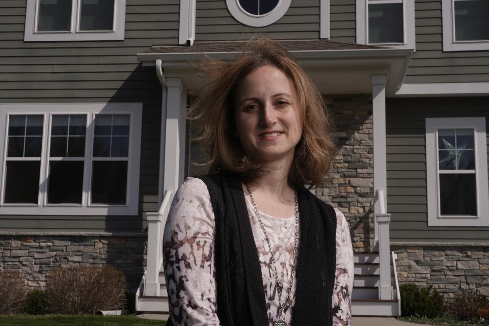 Jana Elkadri poses for a picture outside her Brookfield, Wis., home April 23, 2021. (AP Photo/Morry Gash)