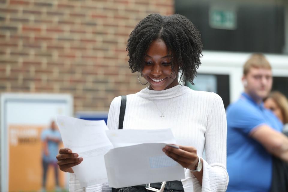 A student receiving her results on Thursday morning (PA)