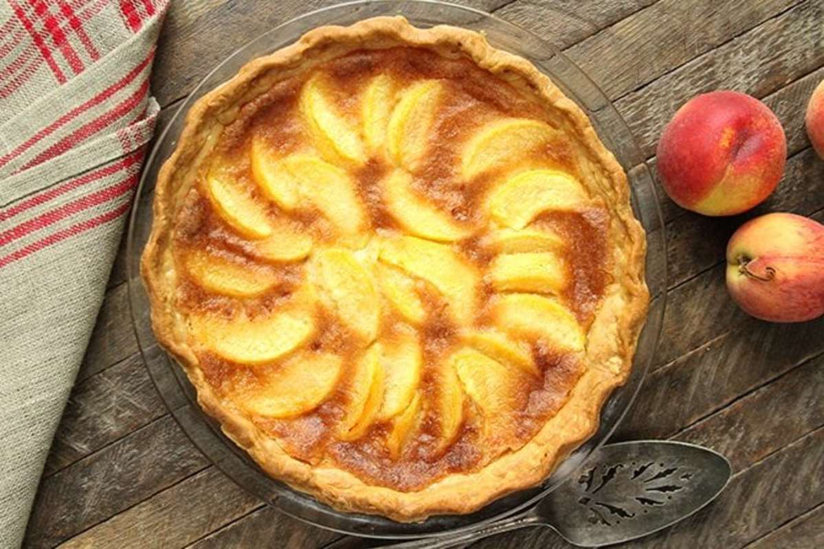 <p>Southern Bite</p><p>If you love chess pie and peach cobbler, this pie is for you!</p><p><strong>Get the recipe: <a href="https://southernbite.com/peach-chess-pie/" rel="nofollow noopener" target="_blank" data-ylk="slk:Peach Chess Pie;elm:context_link;itc:0;sec:content-canvas" class="link rapid-noclick-resp">Peach Chess Pie</a></strong></p>