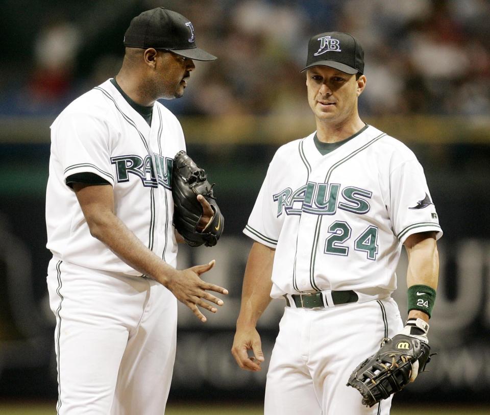 Tampa Bay first baseman Tino Martinez, right, tries to settle down pitcher Dewon Brazelton, left, during the second inning July 17, 2004.