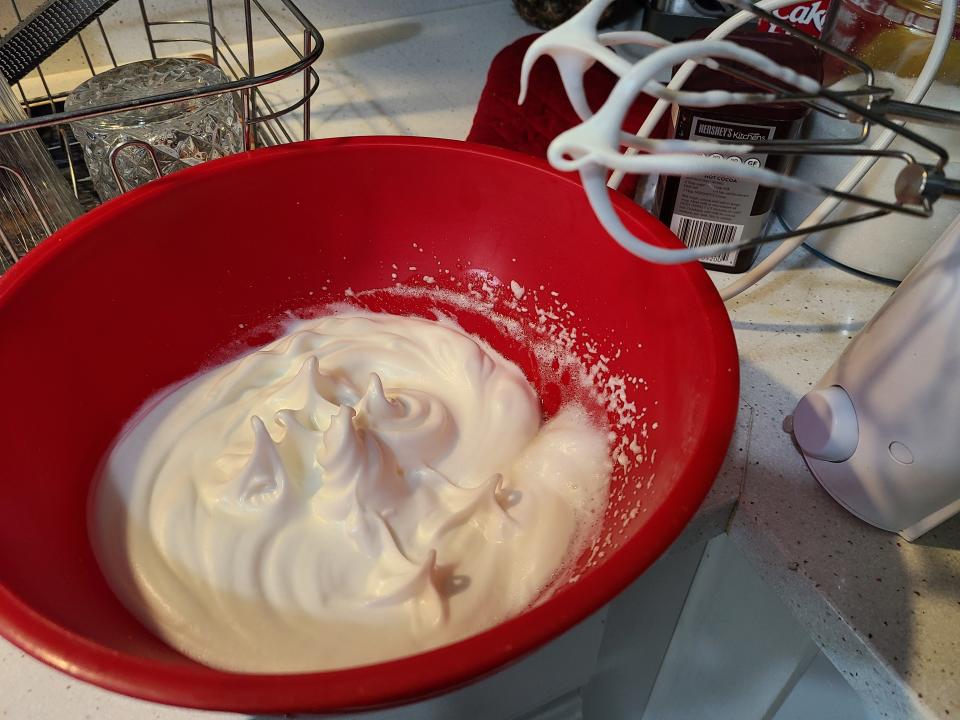 A meringue whipped to stiff peaks with an electric mixer.