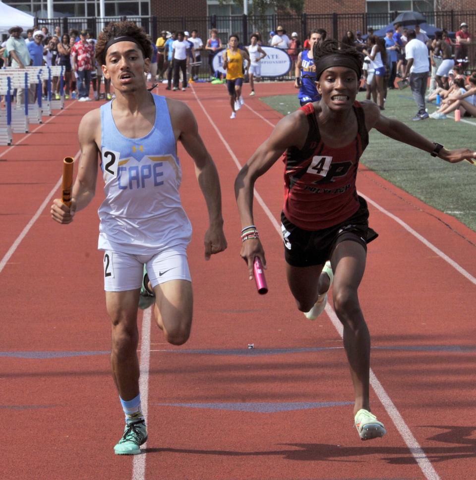 Cape Henlopen's Julian Callaway (left) edges Matt Gatune of Polytech at the finish of the Division I boys 4x800 relay at the DIAA Outdoor Track and Field Championships on Friday.
