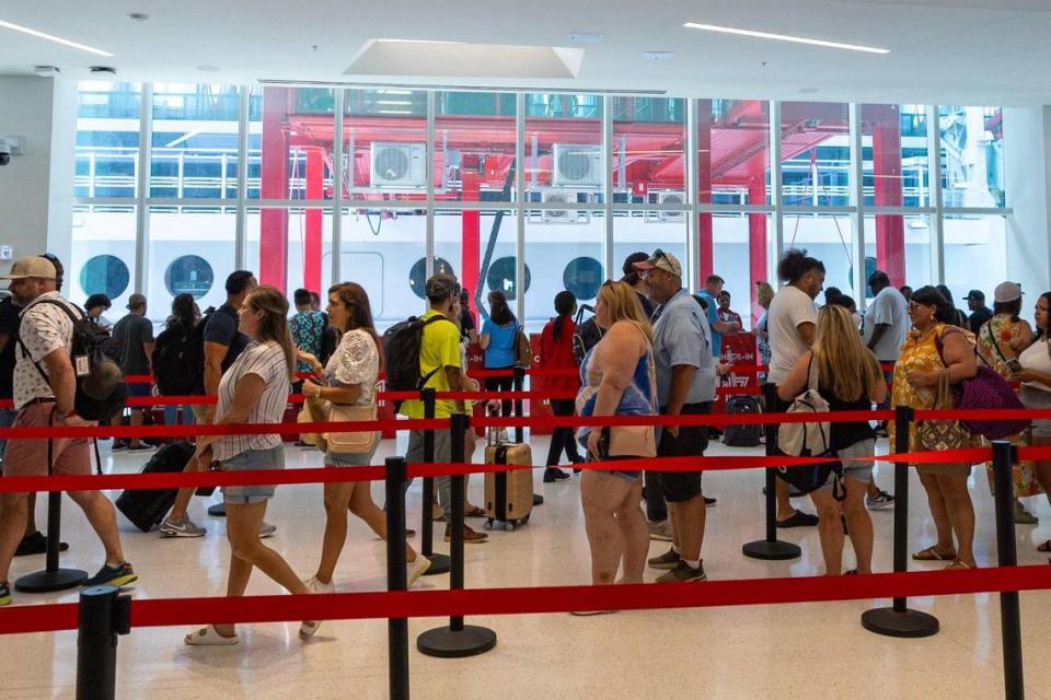 Guests wait to board the Virgin Voyages cruise ship at PortMiami Terminal V in earlier this month.