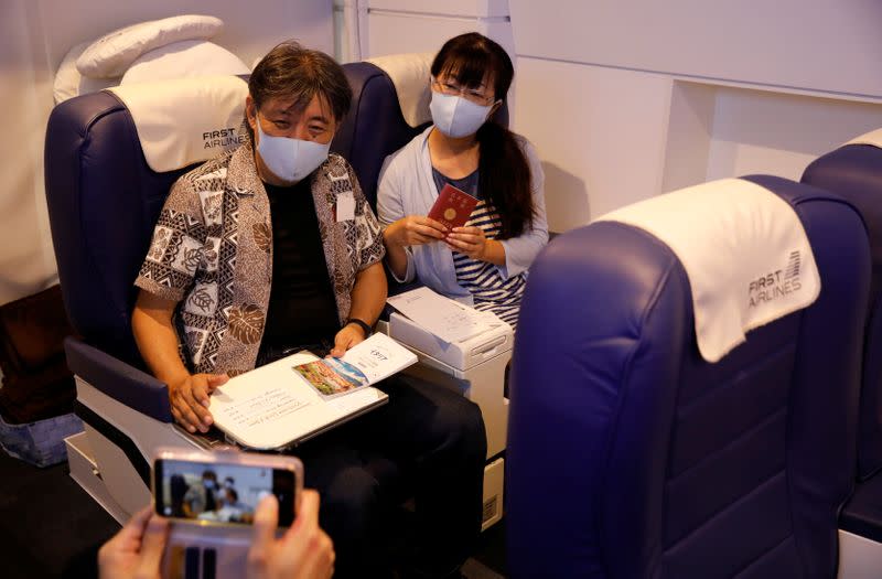 Customers take VR flight experiences at First Airlines in Tokyo