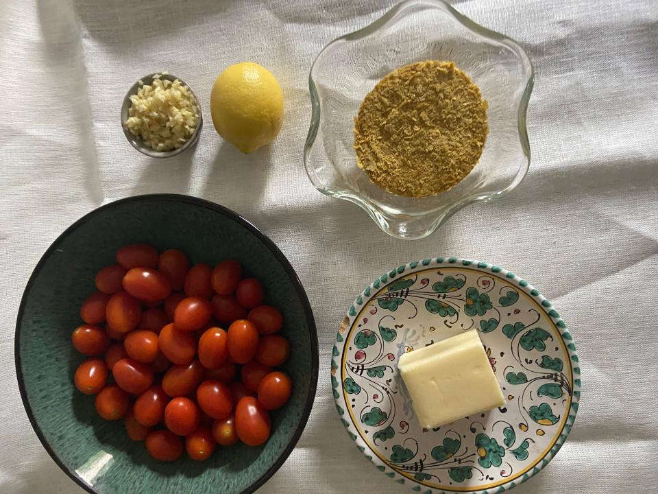 tomatoes, garlic, lemon, nutritional yeast, and butter