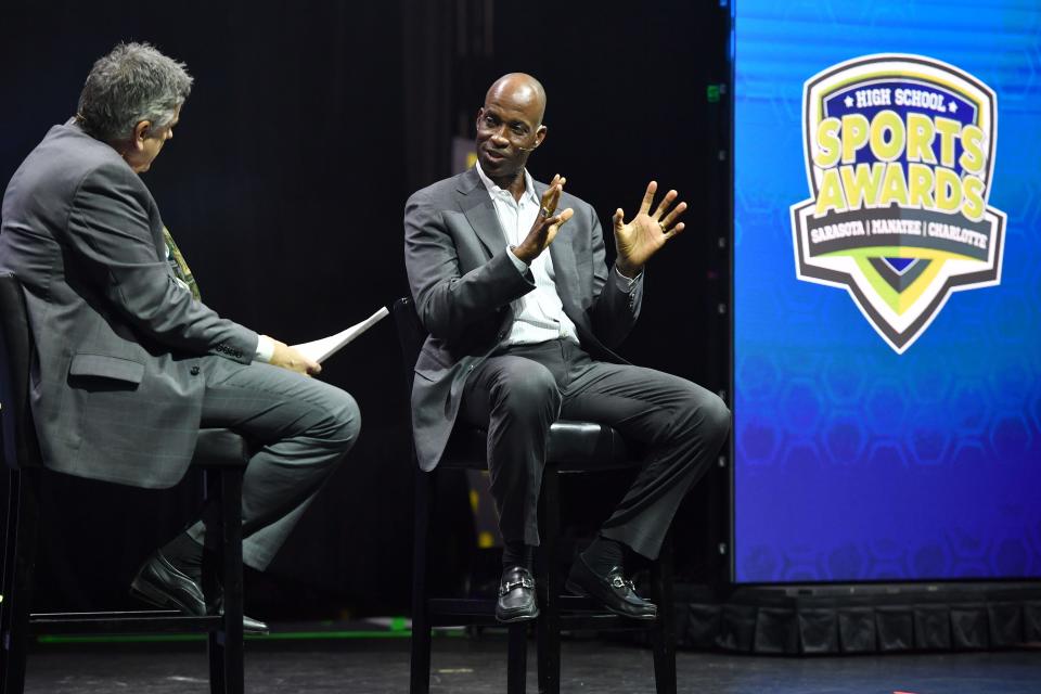 Herald-Tribune sports columnist Doug Fernandes, left, and former Atlanta Brave and Tampa Bay Devil Ray Fred McGriff entertained the crowd with some baseball memories.