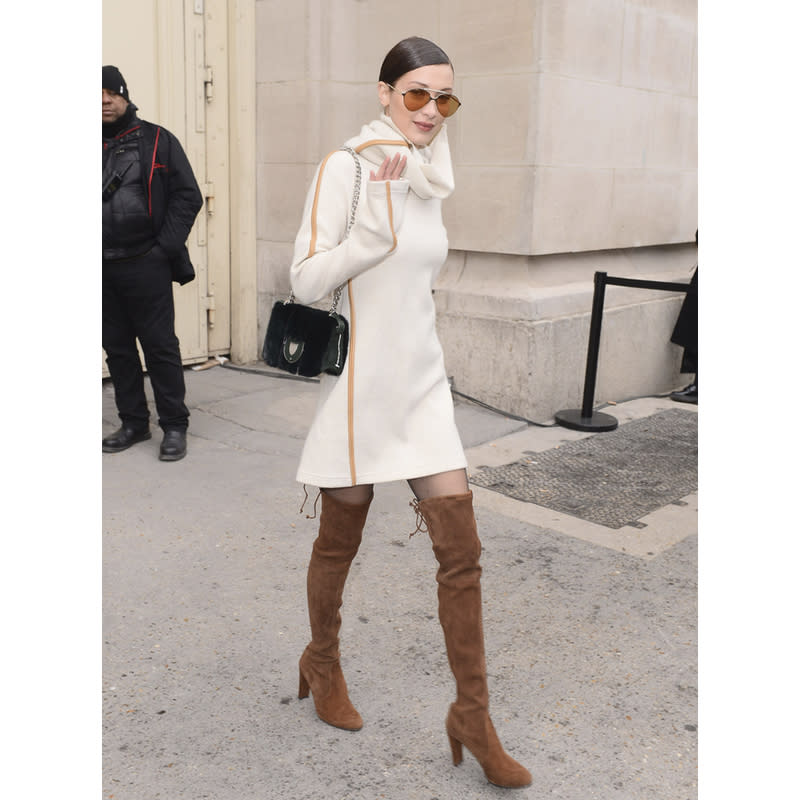 In Stuart Weitzman Boots And Carrera Sunglasses