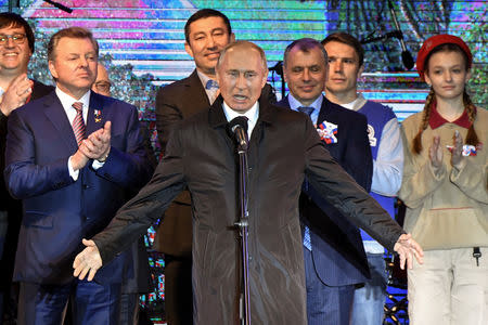 Russian President Vladimir Putin addresses the crowd during a concert marking the fifth anniversary of Russia's annexation of Crimea, in Simferopol March 18, 2019. Yuri Kadobnov/Pool via REUTERS