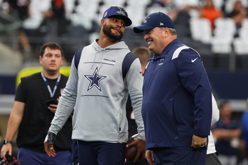 Dallas Cowboys quarterback Dak Prescott (left) isn't worried about coach Mike McCarthy's job security ahead of Monday's playoff game against the Tampa Bay Bucs. (Photo by Richard Rodriguez/Getty Images)