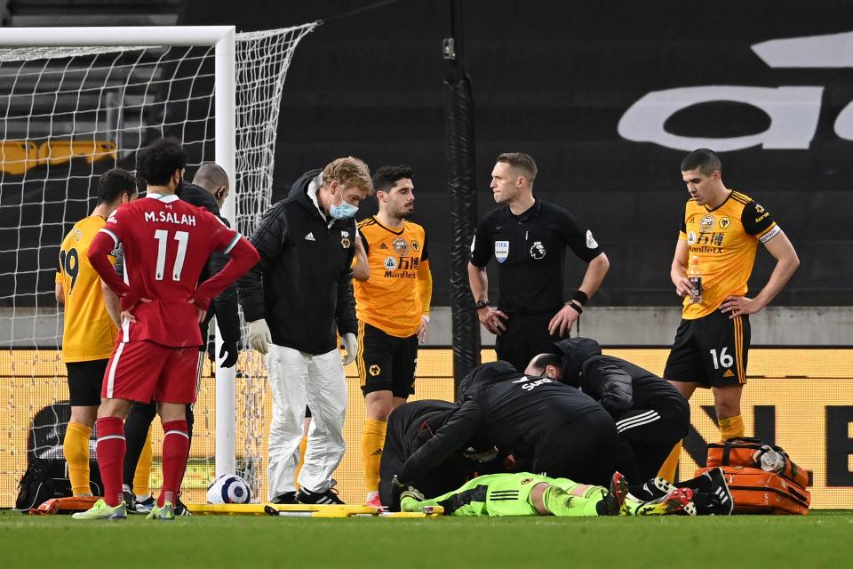 <p>Conor Coady watches on as Rui Patricio receives medical treatment</p> (Getty)