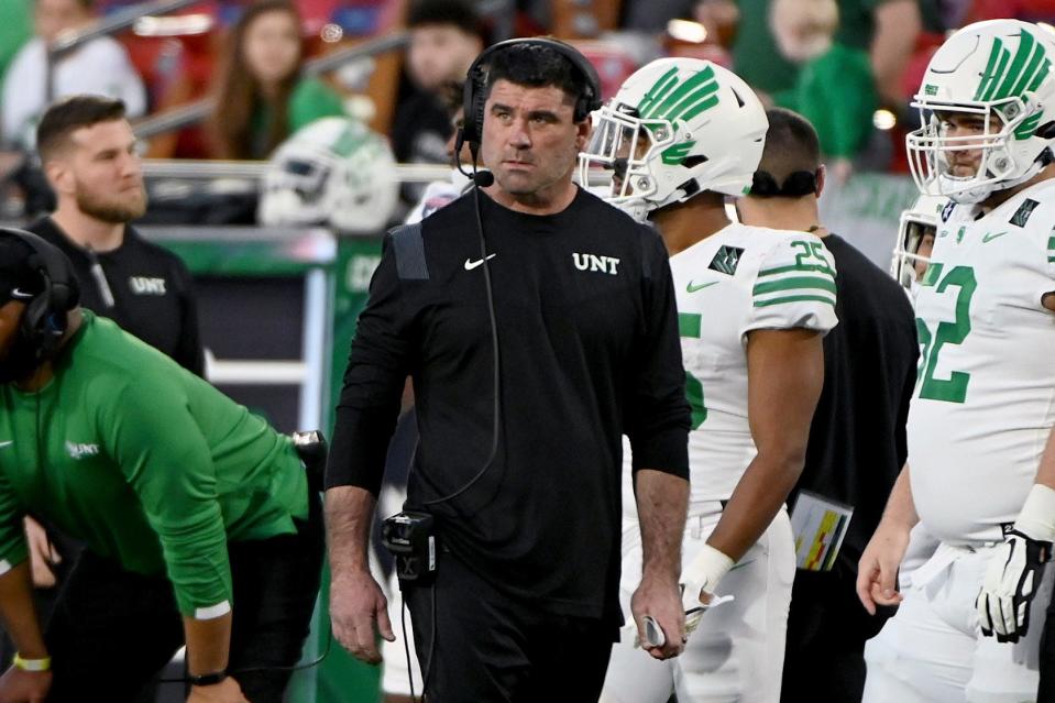 North Texas head coach Seth Littrell walks the sidelines in the first second of the Frisco Football Classic NCAA college football game against Miami (Ohio) in Frisco, Texas, Thursday, Dec. 23, 2021. (AP Photo/Matt Strasen)