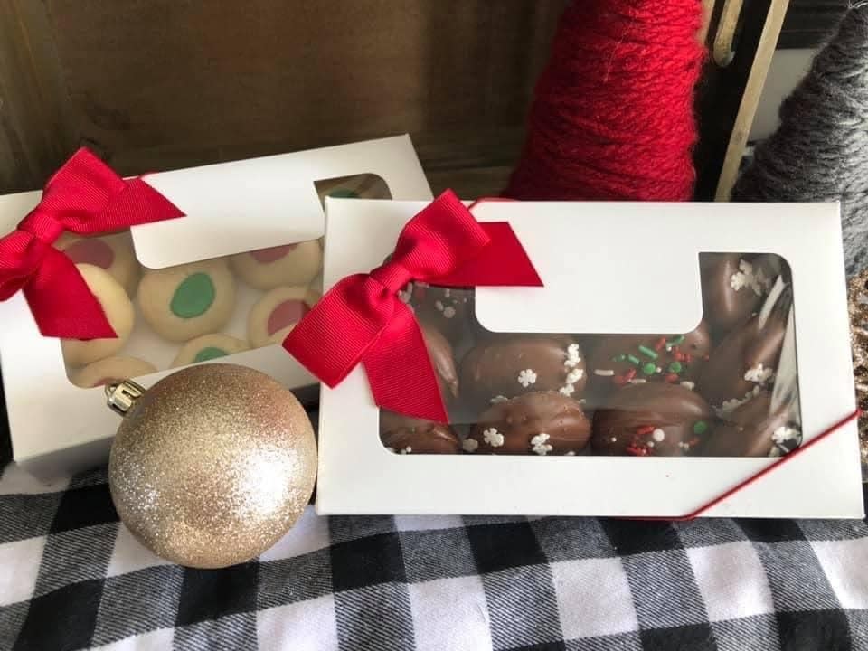 Cookie boxes from Love Is Blind Bakery feature chocolate-dipped Oreos and more.