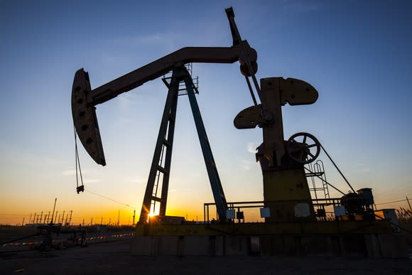 An oil pump at dusk.