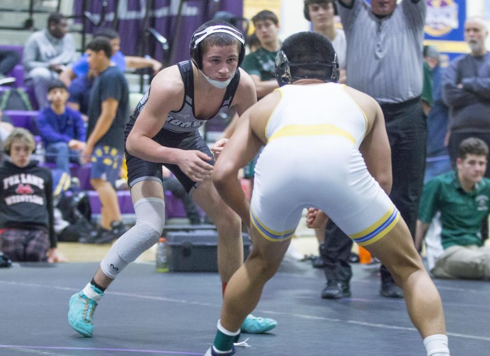 Byram Hills/Briarcliff/Valhalla/Westlake's Neil Paulercio wrestles against Mahopac's Joe Ramirez in the 118-pound finals of the Murphy-Guccione Shoreline Classic at New Rochelle High School on Jan. 7, 2023.