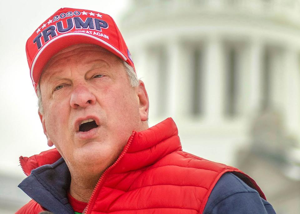 Max Linn talks to reporters Jan. 9, 2021, near the Maine State House, in Augusta, Maine. Linn, a former U.S. Senate candidate from Maine who shook up a high profile race with his antics during debates, has died. He was 62.