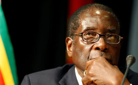 FILE PHOTO - Zimbabwe's President Robert Mugabe listens at the opening of the summit of the Southern African Development Community (SADC) in Johannesburg, South Africa August 16, 2008. REUTERS/Mike Hutchings/File Photo