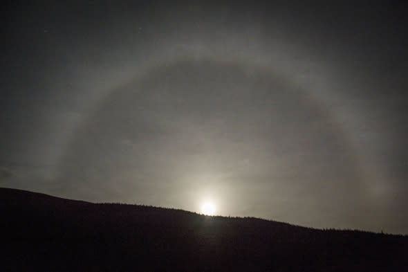 Mandatory Credit: Photo by John Linton Photography/REX (4239643e) A moon ring or halo created by suspended ice crystals in the air Moon ring or halo over Tyndrum, Scotland - 05 Nov 2014 A moon ring or halo, created by suspended ice crystals in the air, is seen over Tyndrum in the Highlands of Scotland. In folklore moon rings are said to warn of approaching storms. 