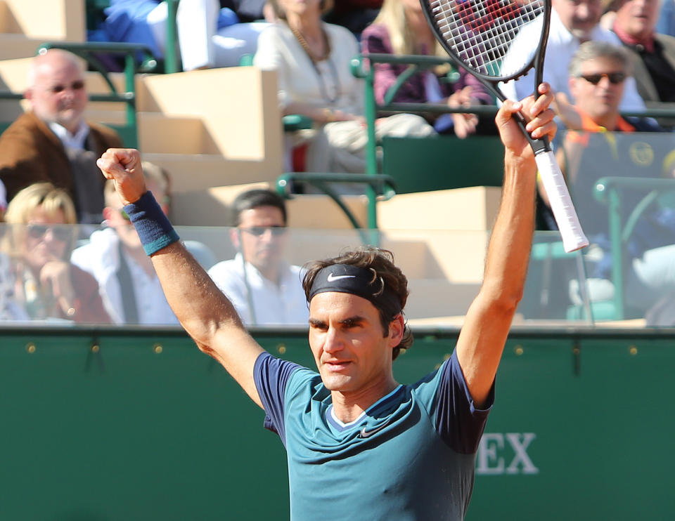 Roger Federer of Switzerland celebrates after defeating Novak Djokovic of Serbia, in their semifinal match of the Monte Carlo Tennis Masters tournament, in Monaco, Saturday, April, 19, 2014. Federer won 7-6, 6-2. (AP Photo/Claude Paris)