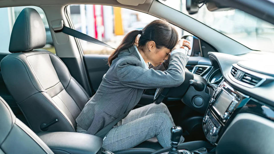 Woman tired in her car