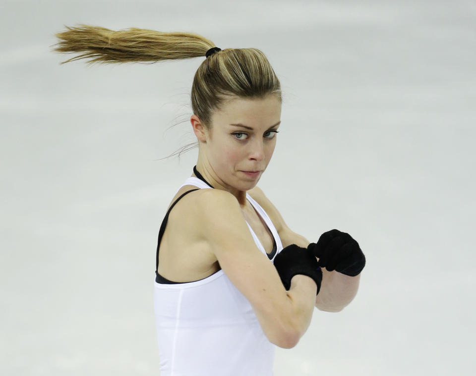 Ashley Wagner of the United States skates during a practice session at the figure stating practice rink at the 2014 Winter Olympics, Monday, Feb. 17, 2014, in Sochi, Russia. (AP Photo/Darron Cummings)