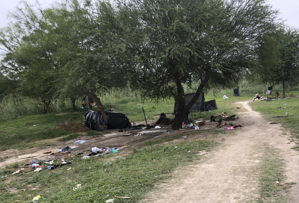 Makeshift tents and debris are seen at a migrant camp in Matamoros, Mexico, Friday, April 21, 2023. About two dozen makeshift tents in the area were set ablaze and destroyed, across the border from Texas this week, witnesses said. (AP Photo/Valerie Gonzalez)