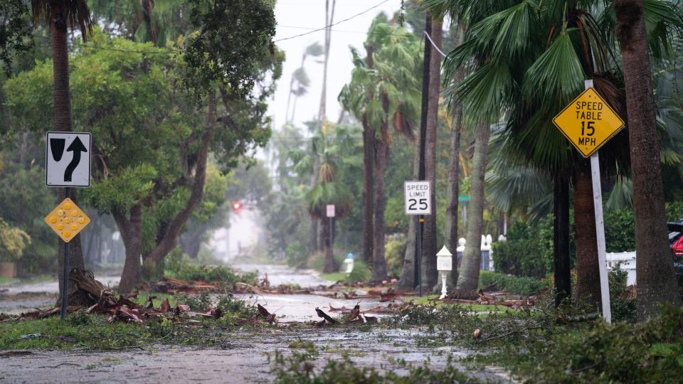 SARASOTA, FL - SEPTEMBER 28: Storm debris litters a street in the wake of Hurricane Ian September 28, 2022 in Sarasota, Florida. Ian made landfall this afternoon, packing 150-mile-per-hour winds and a 12-foot storm surge and knocking out power to nearly 1.5 million customers, according to published reports. (Photo by Sean Rayford/Getty Images)