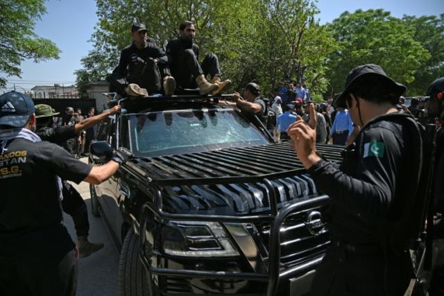 A car carrying Imran Khan arrives at the Islamabad High Court before his arrest on Tuesday