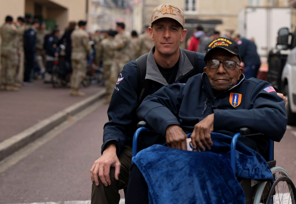 World War II veteran Richard Stewart, 102, was accompanied by Zac Cromley, a volunteer companion, in June 2023 while Stewart was on his first trip back to Normandy since he landed there in July 1944.