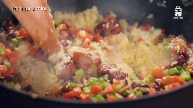 Frying pork and vegetables into Egg Fried Rice