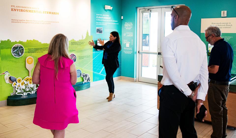 Rachel Jackson, a communications specialist with Florida Power and Light gives a tour of the new solar ranch building at Babcock Ranch on Monday, April 22, 2024. The solar panel field at the ranch is now open to the public. People who tour the ranch will have the opportunity to learn about solar power and how it is harnessed with interactive displays.