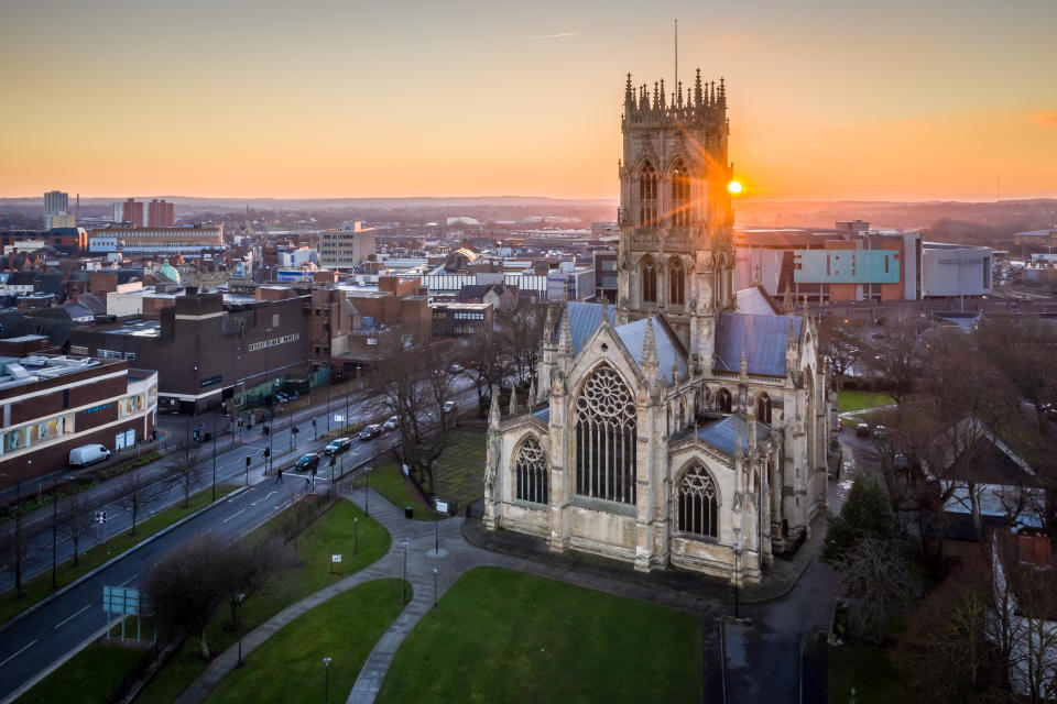 Doncaster, UK - January 13, 2022.  An aerial view of St George's church or Doncaster Minster at sunset