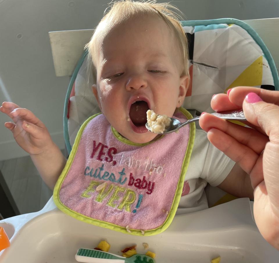 The author's baby eating oatmeal