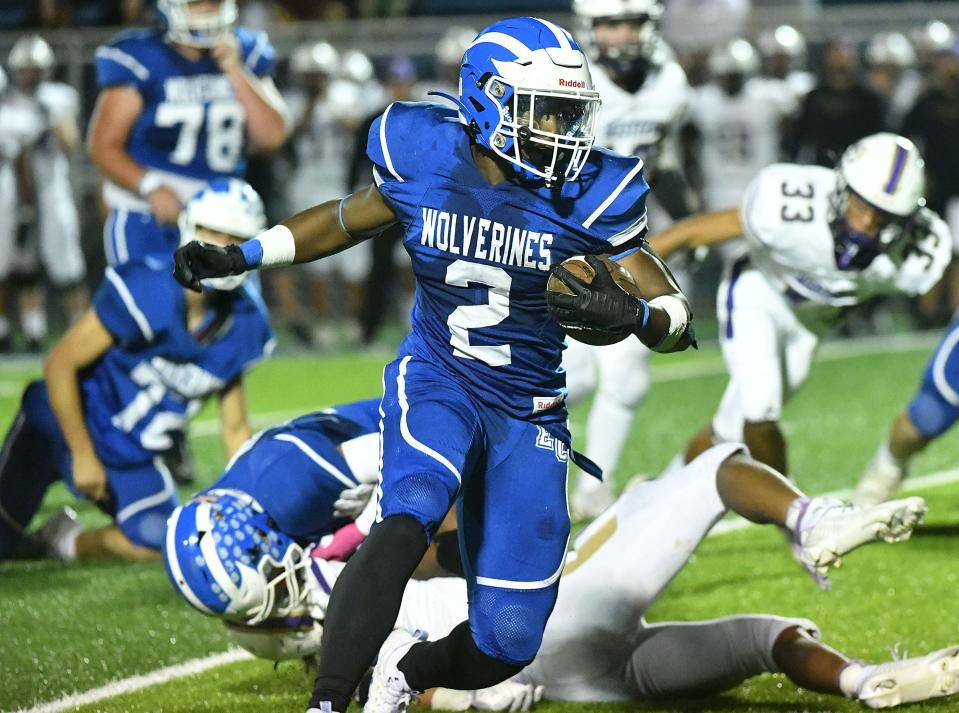 Ellwood’s Elijah Palmer-McCane carries the ball during  Friday night’s game against Western Beaver.